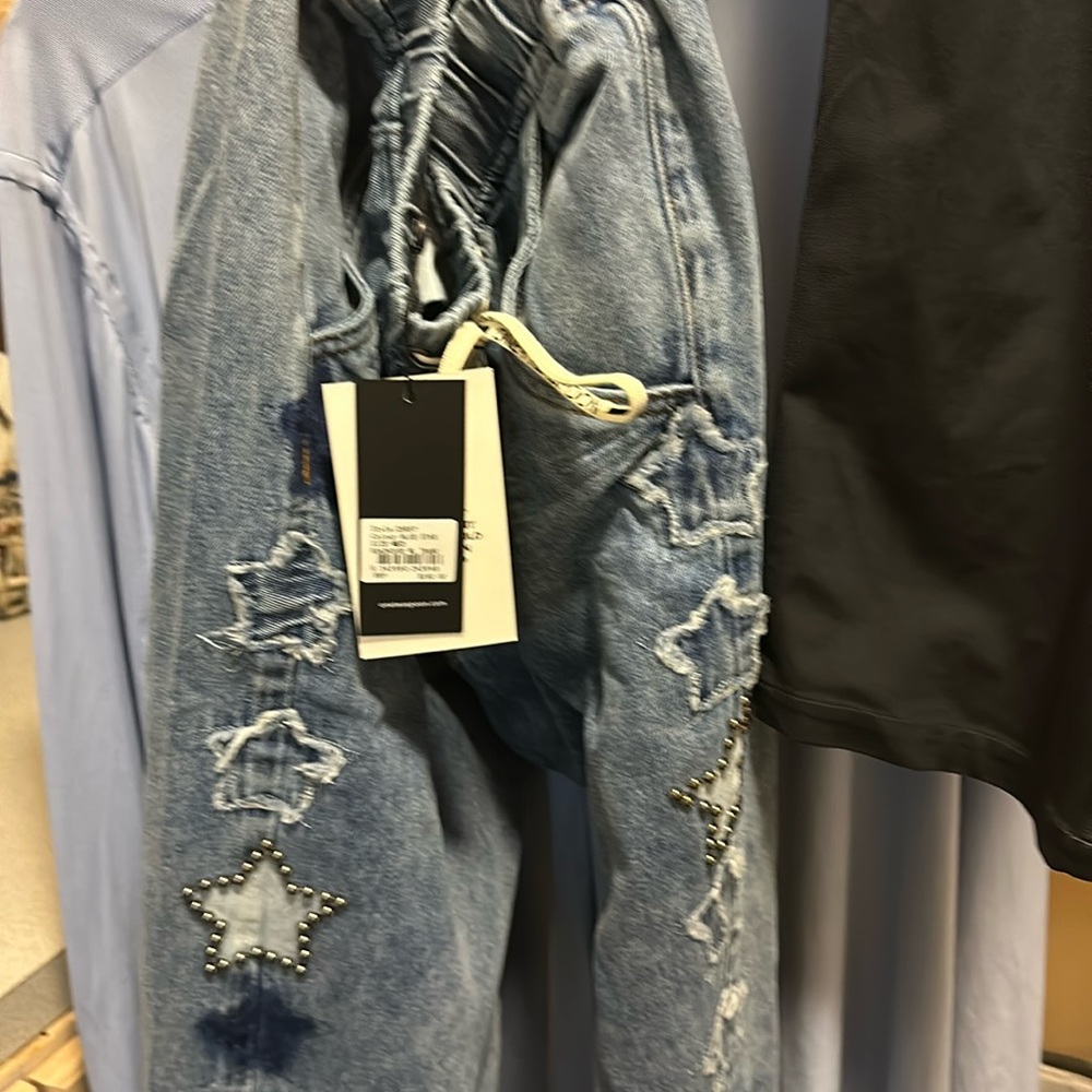 Brand new tags 1 teaspoon jeans with stars down the leg. Every few are studded